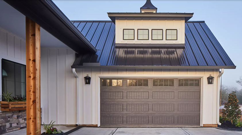 Clopay Classic Steel residential garage door installed on suburban home.