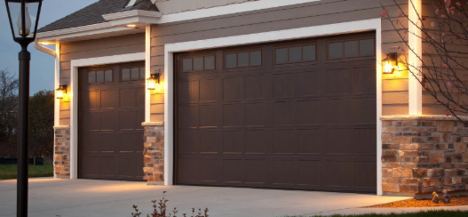 Haas insulated steel residential garage door installed on modern home.